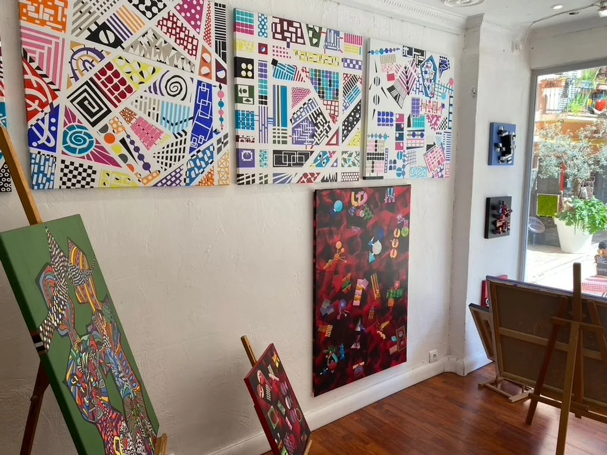 Interior of Galerie Joie De Vivre looking out to the sunny square, hung with the Geo Series